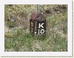 P1040611 * A milestone on the B847.  I wondered what S and K represented.  I presumed Kinloch Rannoch and Struan.  One milestone was missing its metal plates and one was now just a small lump of red stone. * 1920 x 1440 * (1.18MB)